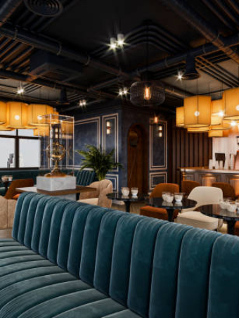Modern restaurant interior with an industrial style and luxurious furniture.